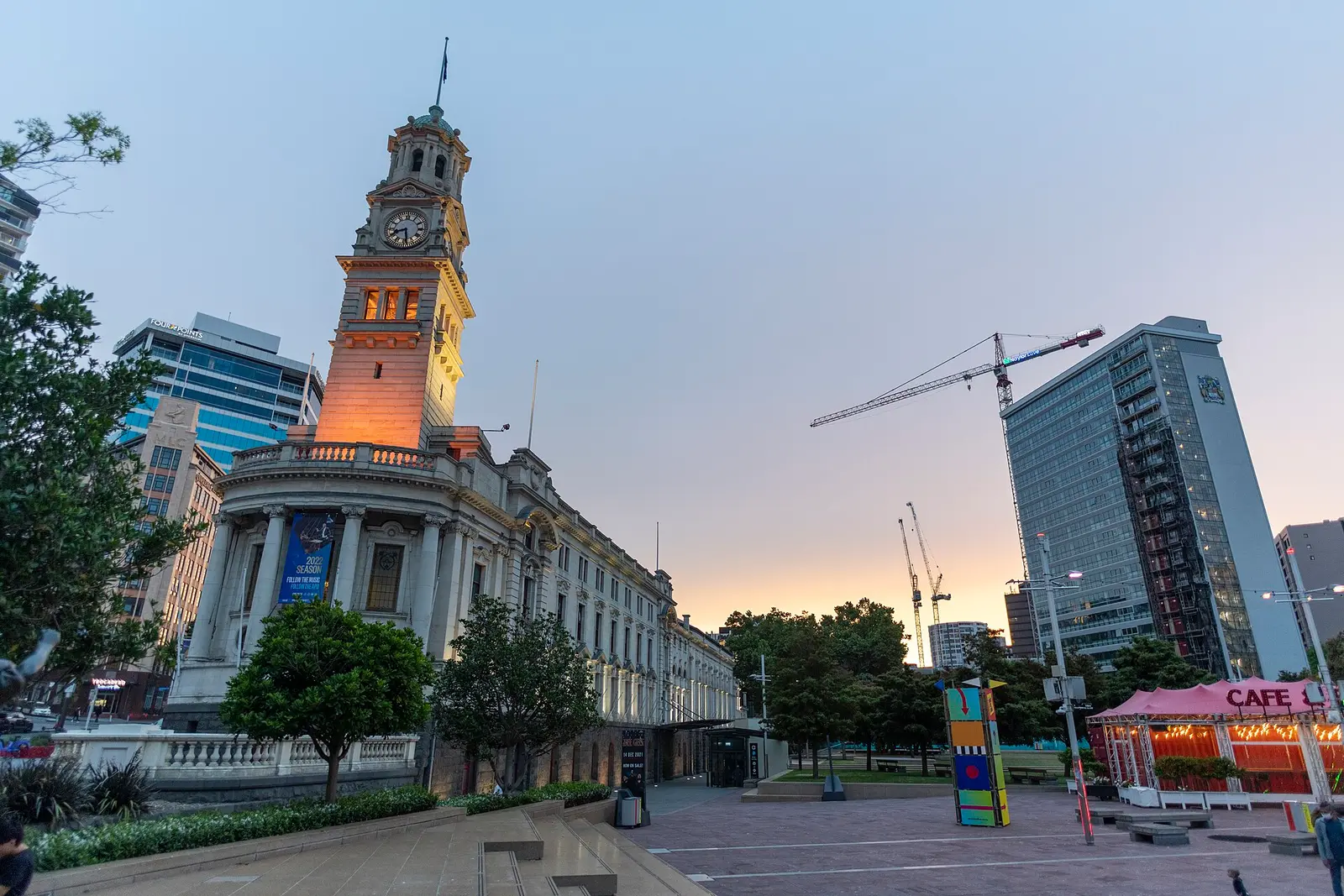 Aotea Square with Auckland Town Hall clock tower at dusk