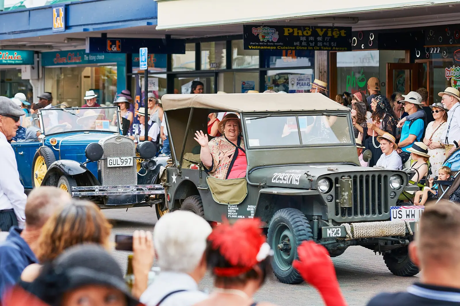 Vintage jeep in the street parade with spectators at Napier Art Deco Festival 2020